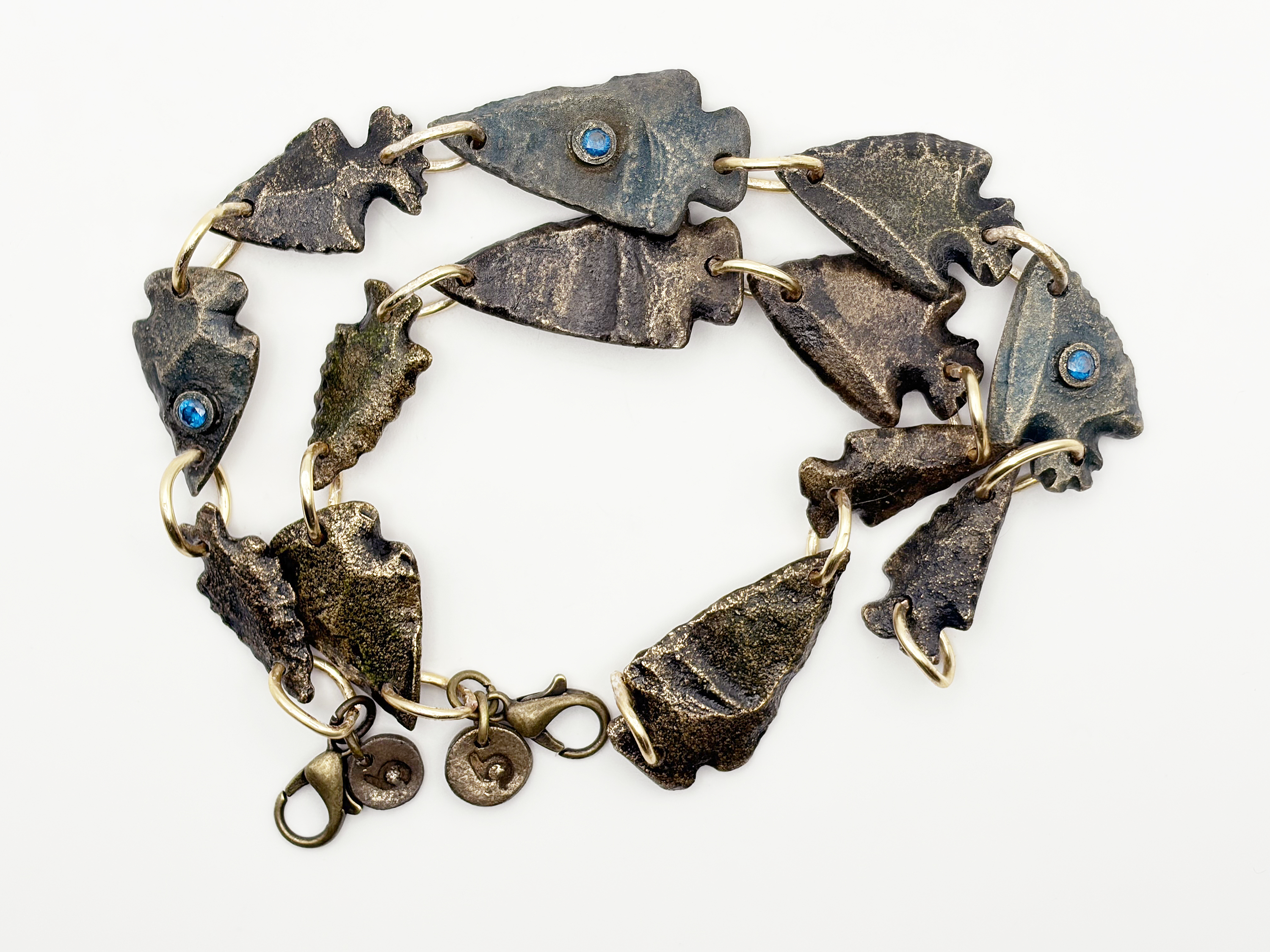 Yellow bronze cast arrowheads bracelet with gems