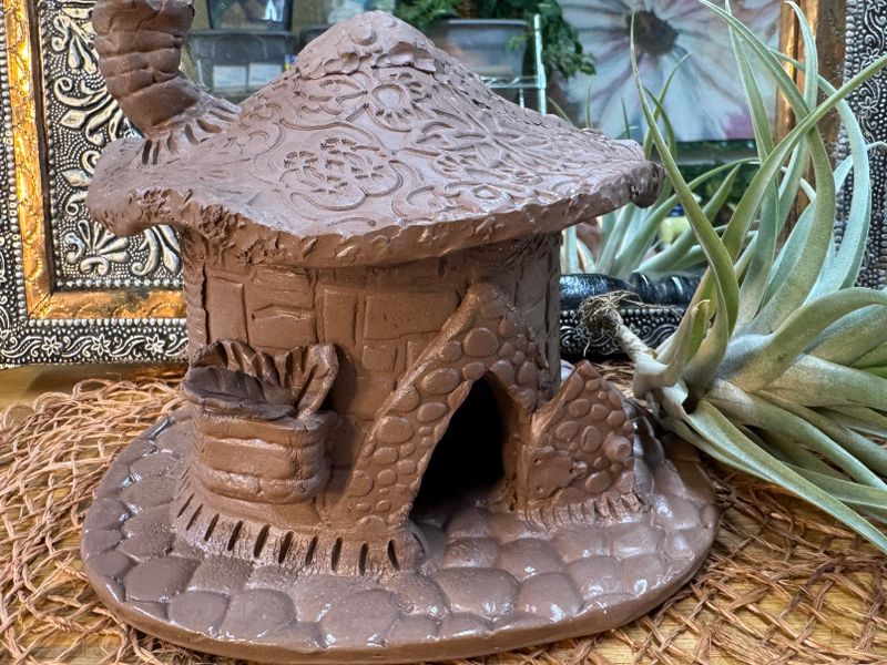 A handbuilt stoneware piece from a beginner pottery class